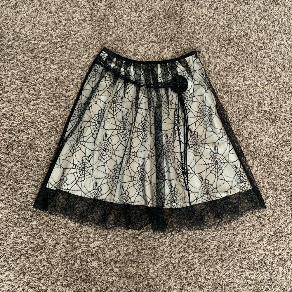 white skirt with black mesh